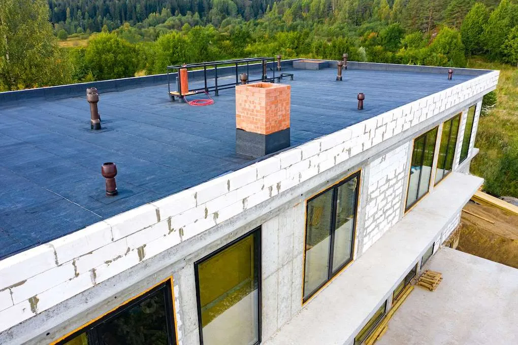 New TPO flat roof system installed on a commercial building in the South Denver Metro