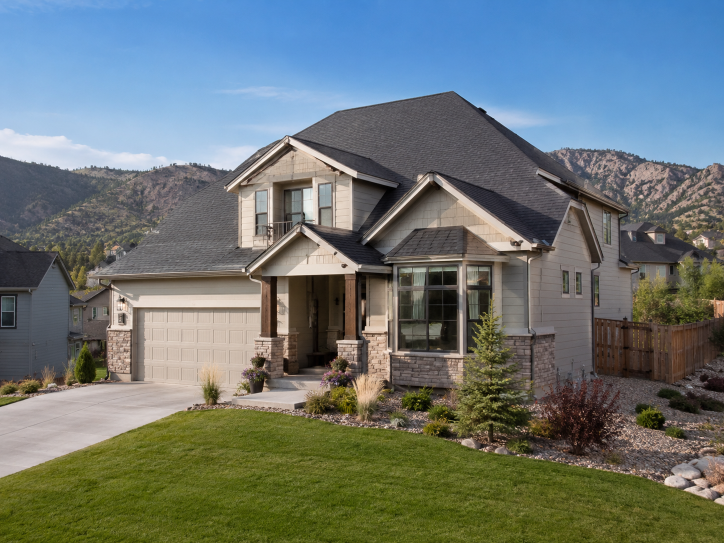 Craftsman home with a new roof and stone accents against the Colorado foothills in Parker